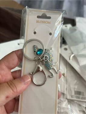 4/$50 Blossom Silver Cat Keychain with Teal Crystals